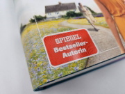 Buchcover und Innenansicht für das Buch: A Different World
